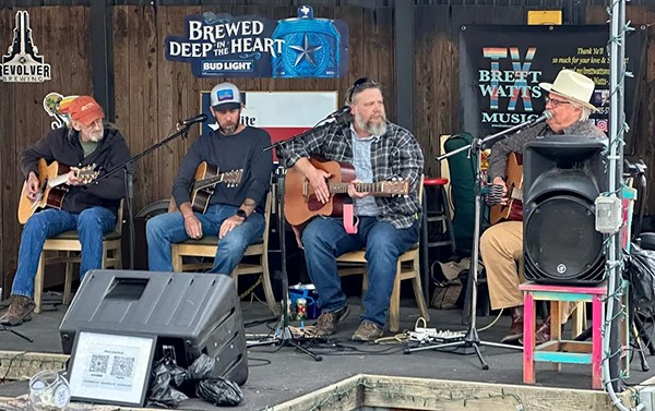 Musicians playing on stage.
